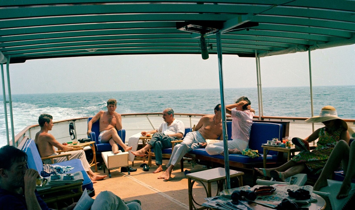 JFK and friends lounging on the deck of Honey Fitz