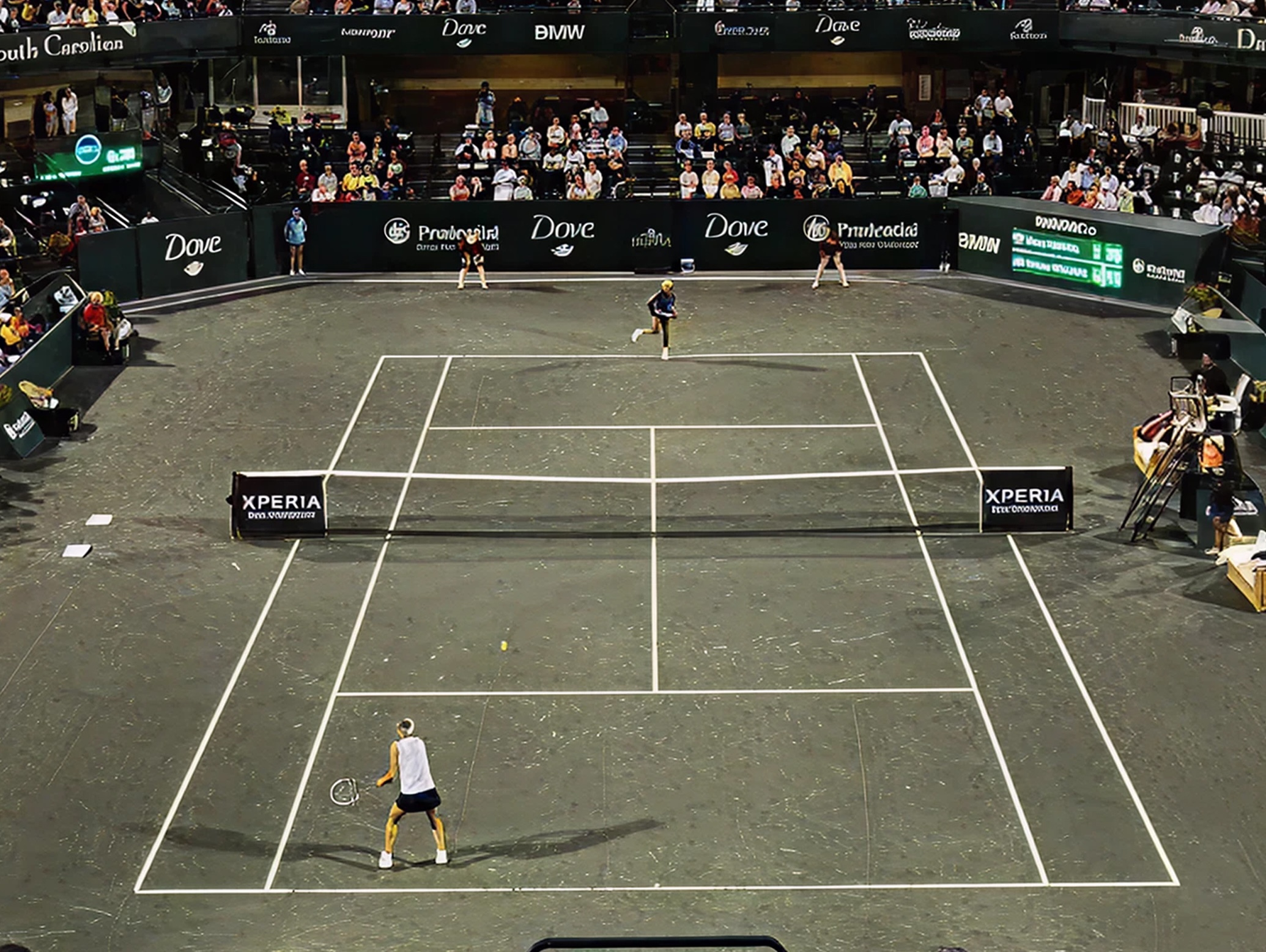 Tennis match at the Charleston Open stadium with spectators in attendance