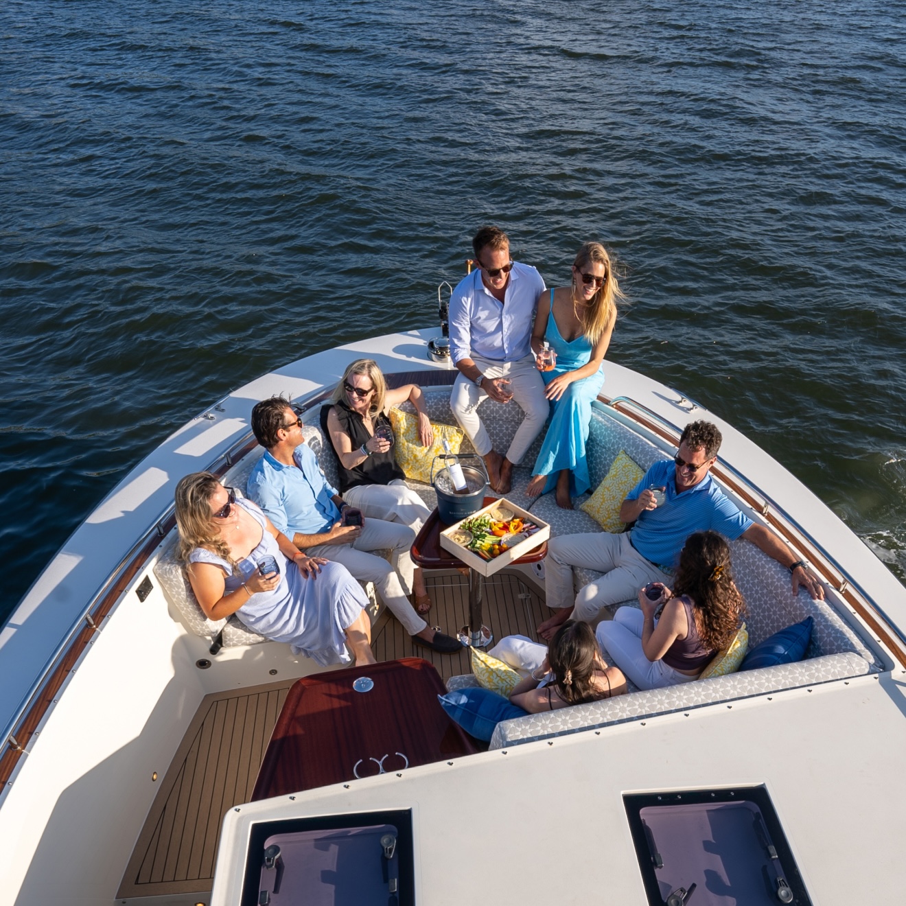 Guests lounging in the bow of a Daychaser