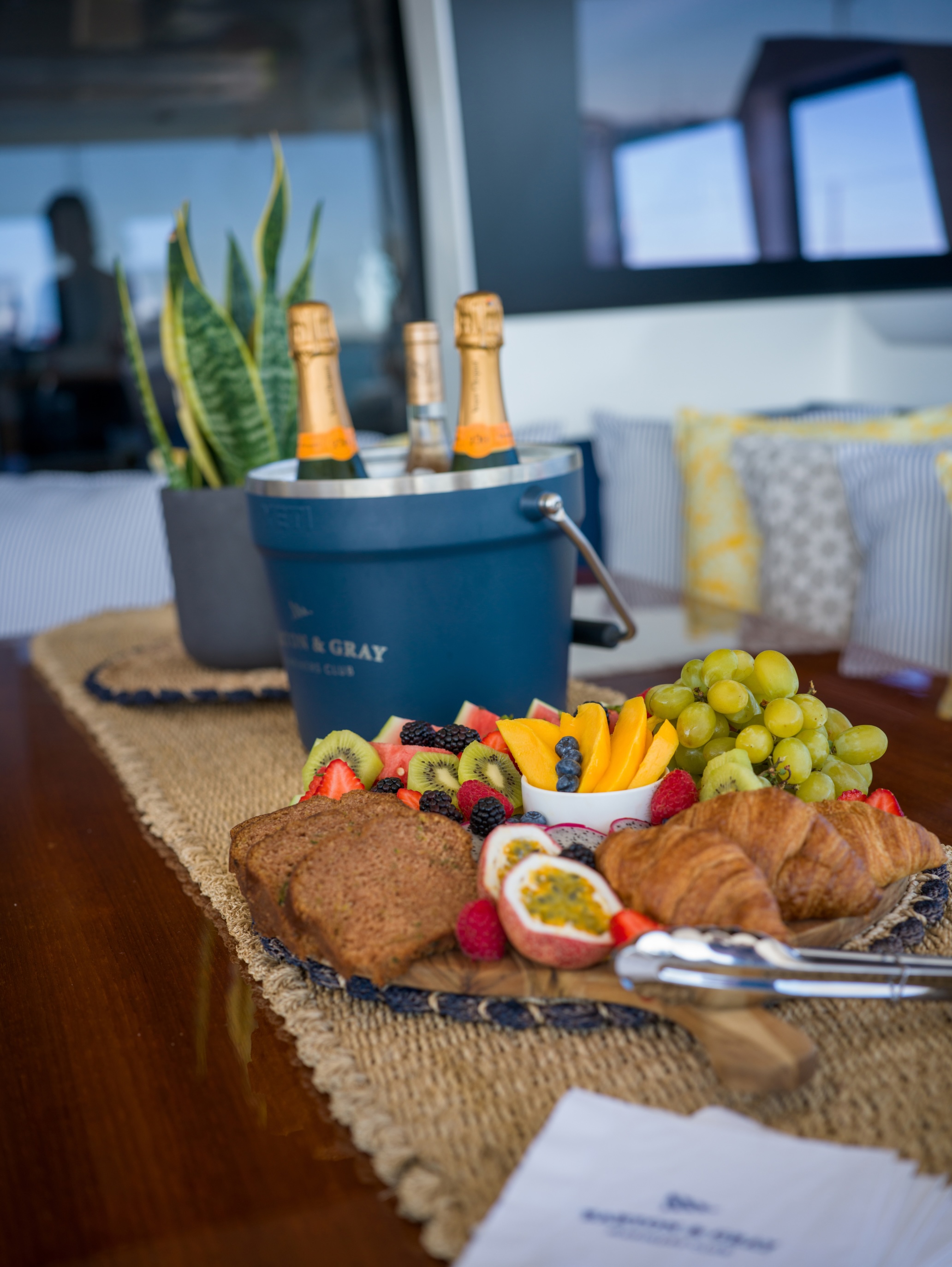 Champagne alongside a fruit board