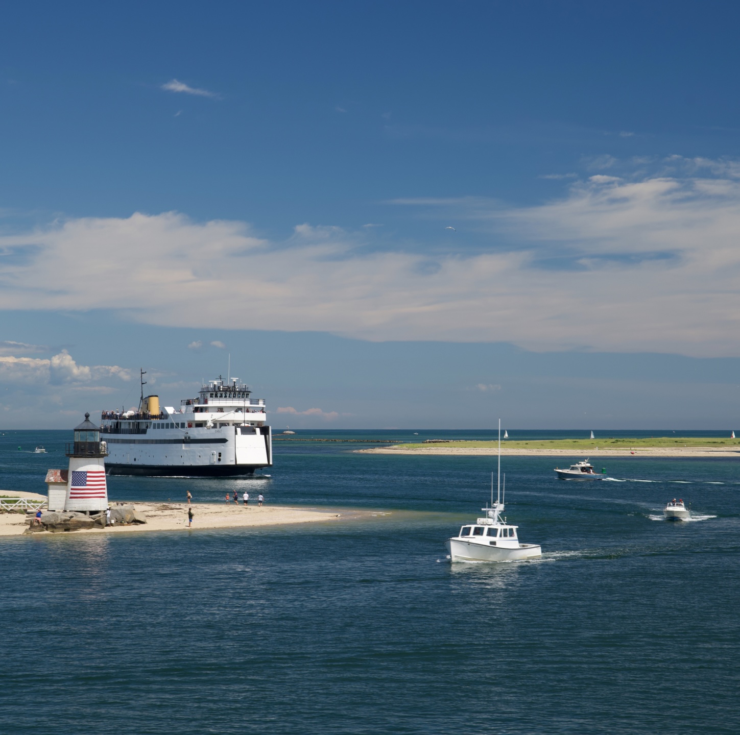 Boats cruising through channel in Cape Cod