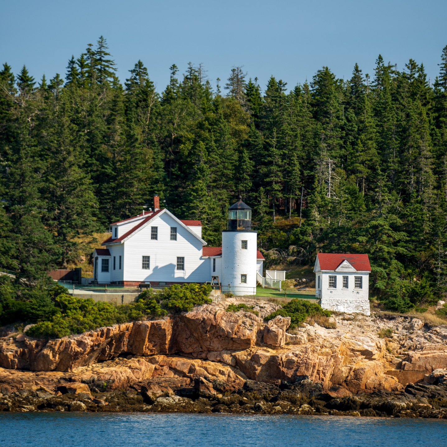 Lighthouse against the rocky coast of Downeast Maine