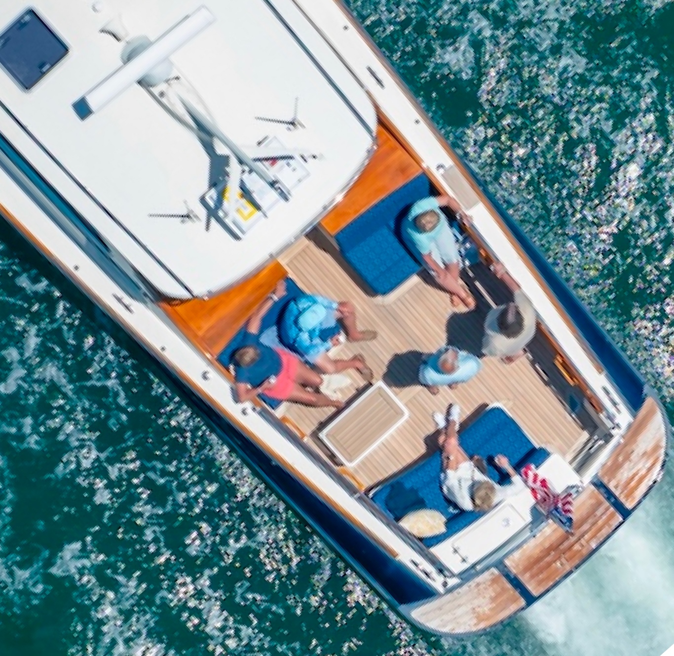 Top down POV of a party enjoying oysters on the deck of a Barton & Gray yacht.